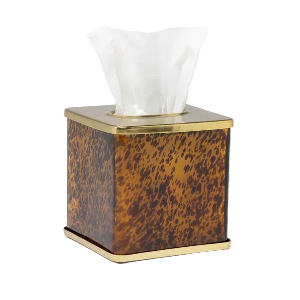 The Benton Tortoise Bath Collection by Pigeon & Poodle offers a square tissue box cover featuring a brown and gold pattern with metallic edges, adding elegance to your bath décor while discreetly holding white tissues.