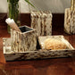 Pigeon & Poodle Bisbee Bath Collection set featuring a tray, a lidded canister, and a square holder for cotton swabs, all finished in a mottled, wood-grain pattern.