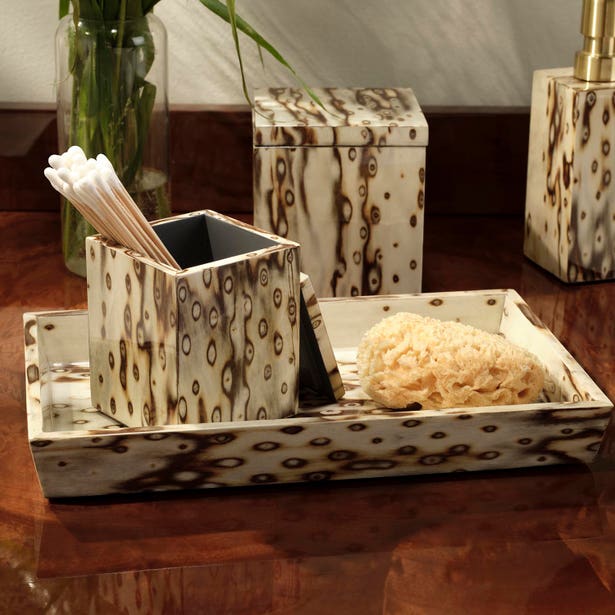 Pigeon & Poodle Bisbee Bath Collection set featuring a tray, a lidded canister, and a square holder for cotton swabs, all finished in a mottled, wood-grain pattern.