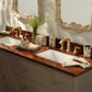 Pigeon & Poodle Bisbee Bath Collection vanity set featuring a patterned tray, soap dispenser, canister, and cup with a matching birdseye burl veneer spotted print.