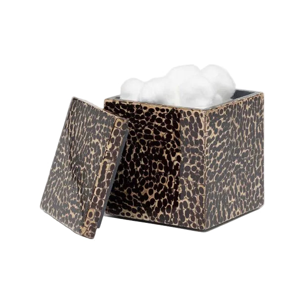 A square, patterned container from Pigeon & Poodle's Callas Bath Collection sits partially open with white cotton balls inside—its surface features a mosaic design reminiscent of lacquered cracked eggshell, and comes with a matching removable lid.