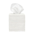 The Dalton Bath Collection by Pigeon & Poodle features a handmade white rattan tissue box cover, highlighting fine craftsmanship with a tissue emerging from the top, set against a plain white background.