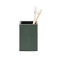 The Manchester Bath Collection by Pigeon & Poodle features a green shagreen-textured toothbrush holder with two bamboo toothbrushes with white bristles, shown on a plain light background.