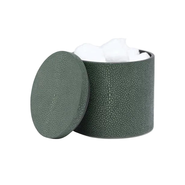 A textured, dark green cylindrical container from the Manchester Bath Collection by Pigeon & Poodle, with a matching lid slightly open to reveal white cotton balls inside and a subtle shagreen finish for an elegant touch.