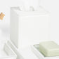 From the Rothwell Bath Collection by Pigeon & Poodle: a white water-resistant yacht leather tissue box holder with tissues, a soap dish with a pale green bar of soap, and a toothbrush on the left side.