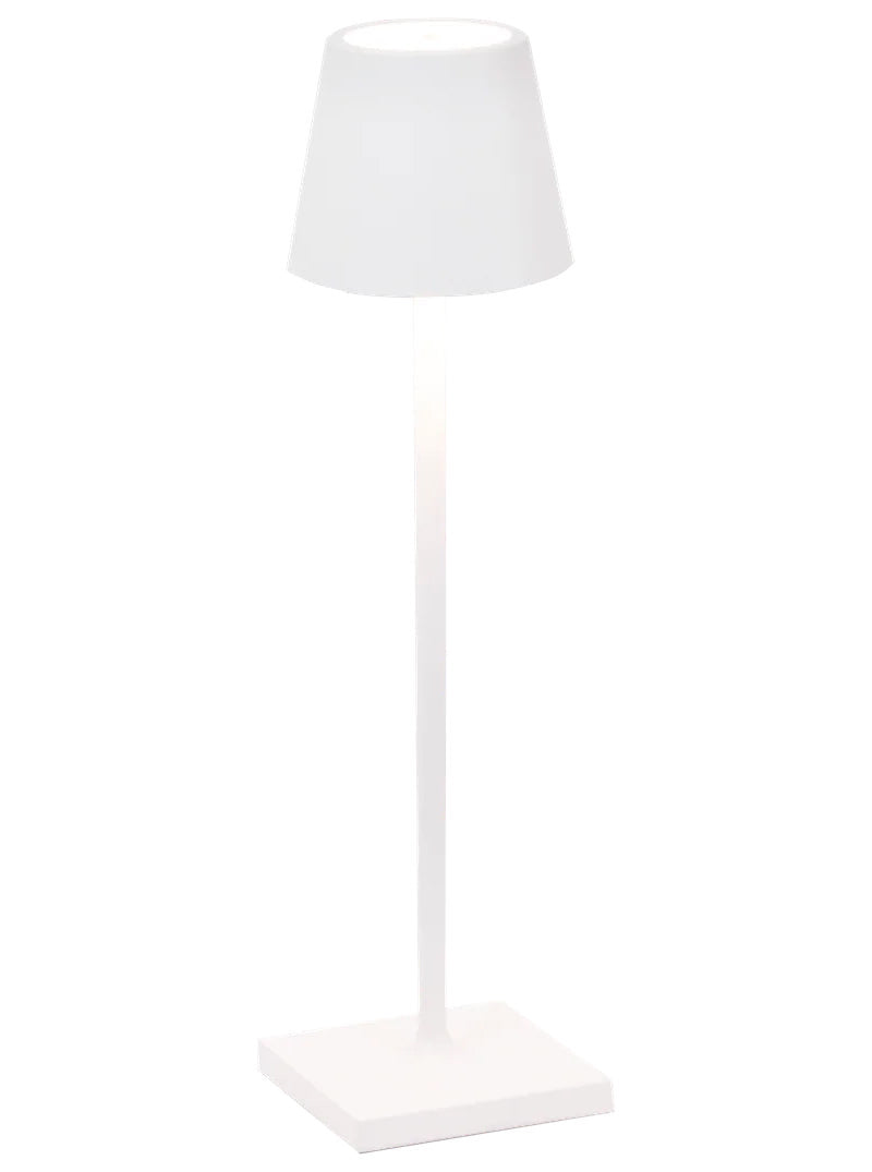 The Poldina Pro Micro Lamp Collection by Zafferano America features a modern, minimalist white cordless table lamp with a square base, slim stem, and conical shade, elegantly photographed against a plain white background.