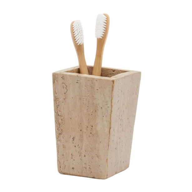 A rectangular stone toothbrush holder from the Bowen Natural Bath Collection by Pigeon & Poodle, featuring two bamboo toothbrushes with white bristles.