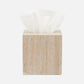 The Bowen Natural Bath Collection tissue box holder by Pigeon & Poodle, in beige stone with a white tissue partially pulled out, is showcased against a plain white background.