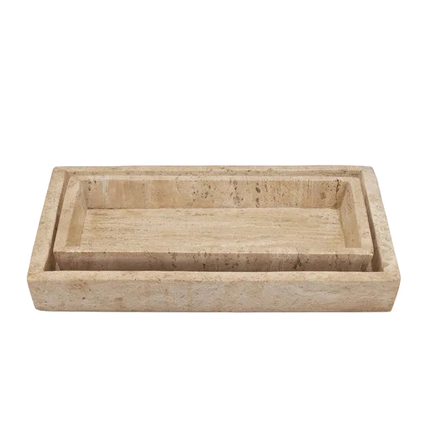 Two rectangular beige stone trays, one nested inside the other, display elegant accessories from the Pigeon & Poodle Bowen Natural Bath Collection on a white background.