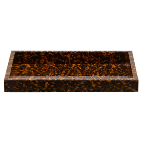 The Carmel High Gloss Faux Tortoise tray by Pigeon & Poodle features raised edges, a tortoise shell pattern, and a glossy finish for an eye-catching look.