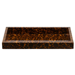 The Carmel High Gloss Faux Tortoise tray by Pigeon & Poodle features raised edges, a tortoise shell pattern, and a glossy finish for an eye-catching look.