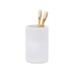 The Pigeon & Poodle Dover Bath Collection features a white textured resin toothbrush holder, shown with two bamboo toothbrushes against a plain white background—an ideal modern bathroom accessory.