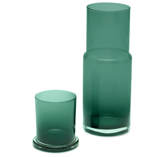 A tall, hand-blown Pigeon & Poodle Faro Glass Carafe in smokey green with a matching short glass and elegant finishes.