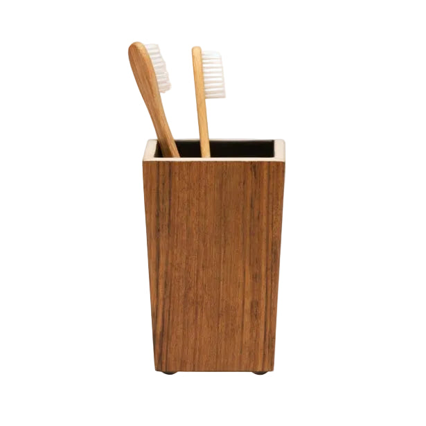 The Harper Dark Teak by Pigeon & Poodle is a rectangular wooden toothbrush holder with elegant details, shown with two wooden toothbrushes inside against a white background.