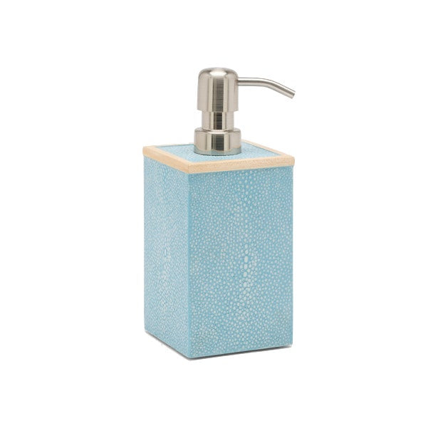 The Manchester Bath Collection by Pigeon & Poodle features a square blue soap dispenser with a textured shagreen finish, beige top trim, and a silver pump.