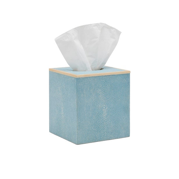 The Manchester Bath Collection by Pigeon & Poodle features a blue square tissue box with a light top, veneer trim, and a partially pulled white tissue.