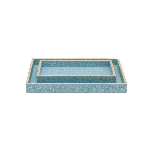 Two rectangular blue trays from the Pigeon & Poodle Manchester Bath Collection, featuring beige veneer trim and a subtle natural eye pattern, with the smaller tray nested inside the larger one, displayed on a white background.
