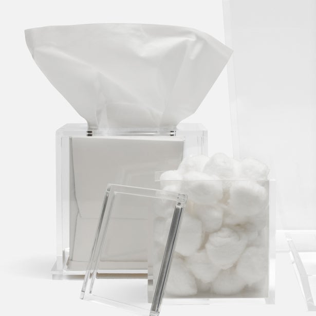 From the Monette Bath Collection by Pigeon & Poodle, this clear acrylic tissue box and matching container hold white tissues and cotton balls, bringing a sleek, modern accent to your bathroom.
