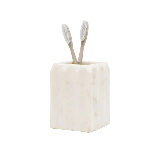 A pleated marble-patterned toothbrush holder from the Proviso White Bath Collection by Pigeon & Poodle holds two beige toothbrushes, displayed on a white background—an elegant touch for luxury home decor.