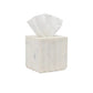 A luxury pleated marble tissue box holder from Pigeon & Poodle’s Proviso White Bath Collection, featuring a single white tissue partially pulled out, is displayed against a plain white background.