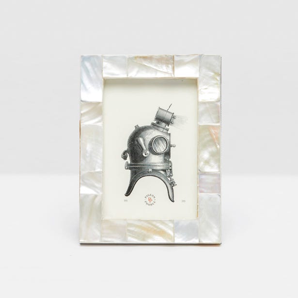 The Lesina Frame Collection by Pigeon & Poodle features a rectangular design with a pearlescent mosaic border, making it an elegant choice for coastal décor and collectors of sophisticated photo frames.