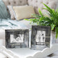 Two framed black-and-white photos and a potted fern sit on an Addison Ross Scalloped White Lacquer Tray Collection piece atop an ottoman in a bright, tidy living room.