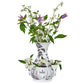 The Juliska Flint Grey Country Estate Tulipiere Vase features black botanical designs and side pockets, beautifully displaying green leaves with white and purple flowers for a refined country estate floral look.