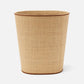 A beige woven wastebasket from Pigeon & Poodle’s Hanford Desk Accessory Collection, featuring raffia and leather details with brown trim accents, is shown against a plain white background.