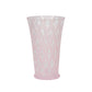 The Juliska Trellis Drinkware Collection features tall, translucent pink glassware with a diamond-patterned texture and slightly flared rims—an elegant addition to any setting.