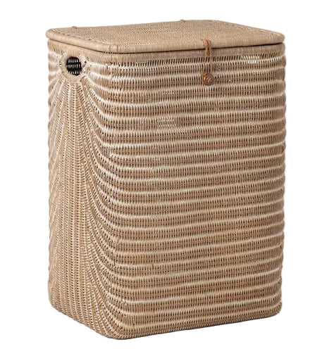 The Mocha Whitewashed Lorain Hamper by Pigeon & Poodle features horizontal rattan weaving, a braided strap closure, and a lid, displayed against a white background.