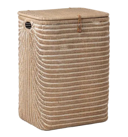 The Mocha Whitewashed Lorain Hamper by Pigeon & Poodle features horizontal rattan weaving, a braided strap closure, and a lid, displayed against a white background.