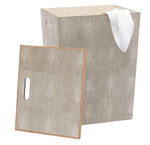 The Pigeon & Poodle Northwich Hamper in Sand Faux Shagreen features a rectangular shape, textured finish, removable lid, and side handles, with a white towel draped over the edge for luxurious storage in any space.