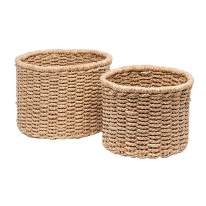 Two Yuma Round Baskets by Pigeon & Poodle, crafted from natural fibers and available in two sizes, offer a stylish woven storage solution for any space.