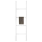 The Pigeon and Poodle Albi Leaning Towel Rack, by Pigeon & Poodle, is a stylish white ladder-style rack with a dark towel on one of the middle rungs, adding elegance to any bathroom.