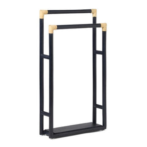 The PIG, Bolzano Towel Rack by Pigeon & Poodle features a black freestanding design with two staggered bars and beige corner accents, bringing subtle coastal style to your bathroom.