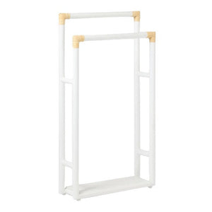 The Bolzano Towel Rack Collection by Pigeon & Poodle features a white freestanding rack with beige corner accents and a rectangular base, bringing coastal charm to your bathroom décor.