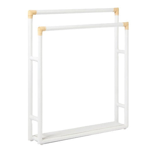 The Bolzano Towel Rack Collection by Pigeon & Poodle features white metal racks with two parallel bars and light wooden joints, ideal for holding towels or linens while bringing coastal charm to your space.