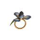 The Juliska Meadow Walk Iris Napkin Ring Set features a gold twisted ring with a hand-painted blue and yellow flower and green leaf, perfect for a spring tablescape or to enhance your Iris Napkin Rings collection.