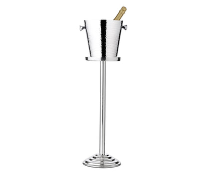 The EDZARD Capri Ice Bucket with Stand Collection features a stylish stainless steel champagne bucket with a bottle inside, elegantly displayed on a tall metal stand—ideal for luxury hotel champagne service.