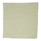 The Juliska Berry Trim Napkin Collection features a plain, light green woven cotton napkin with a fine stitched border, shown laid flat against a white background.