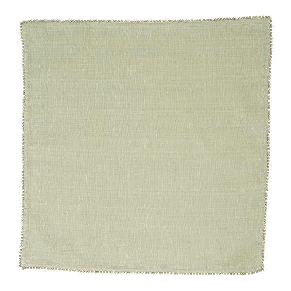 The Juliska Berry Trim Napkin Collection features a plain, light green woven cotton napkin with a fine stitched border, shown laid flat against a white background.