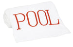 The Hamburg House Pool Towel in dark orange is folded on a white background with "POOL" in bold red letters—a stylish poolside accessory.
