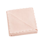 The Gooselings Cotton Knit Baby Blanket, in light pink 100% cotton with scalloped edges, is displayed folded against a white background—an ideal soft accent for any nursery.