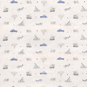 Introducing the Transit Treasures Bedding Collection by Gooselings, featuring patterned fabric with charming illustrations of vintage cars, bicycles, airplanes, hot air balloons, ships, and small stars in blue and gray on a crisp white background. Expertly crafted from pure materials that are OEKO-TEX certified for your peace of mind.
