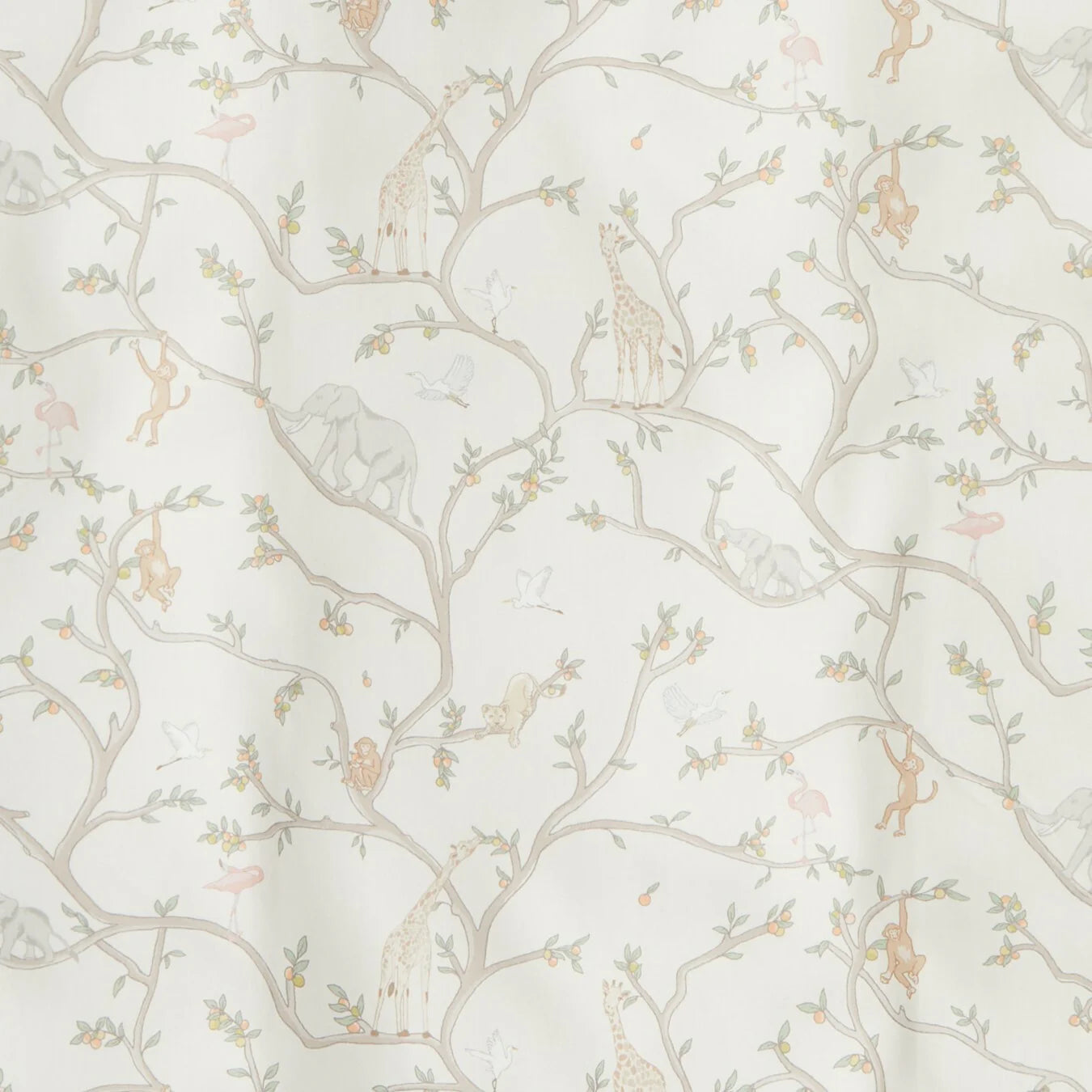 The Animal Parade Ivory Bedding Collection by Gooselings features adorable tree branches with giraffes, elephants, monkeys, birds, and leaves—perfect to pair with kids pillows for a dreamy children’s room.