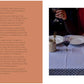 A woman in a dark sweater sits at a table set for “A Meal For Two” by Chronicle Books, featuring a blue checkered tablecloth, wine, cutlery, plates, and a candle, beside another person dressed in red.