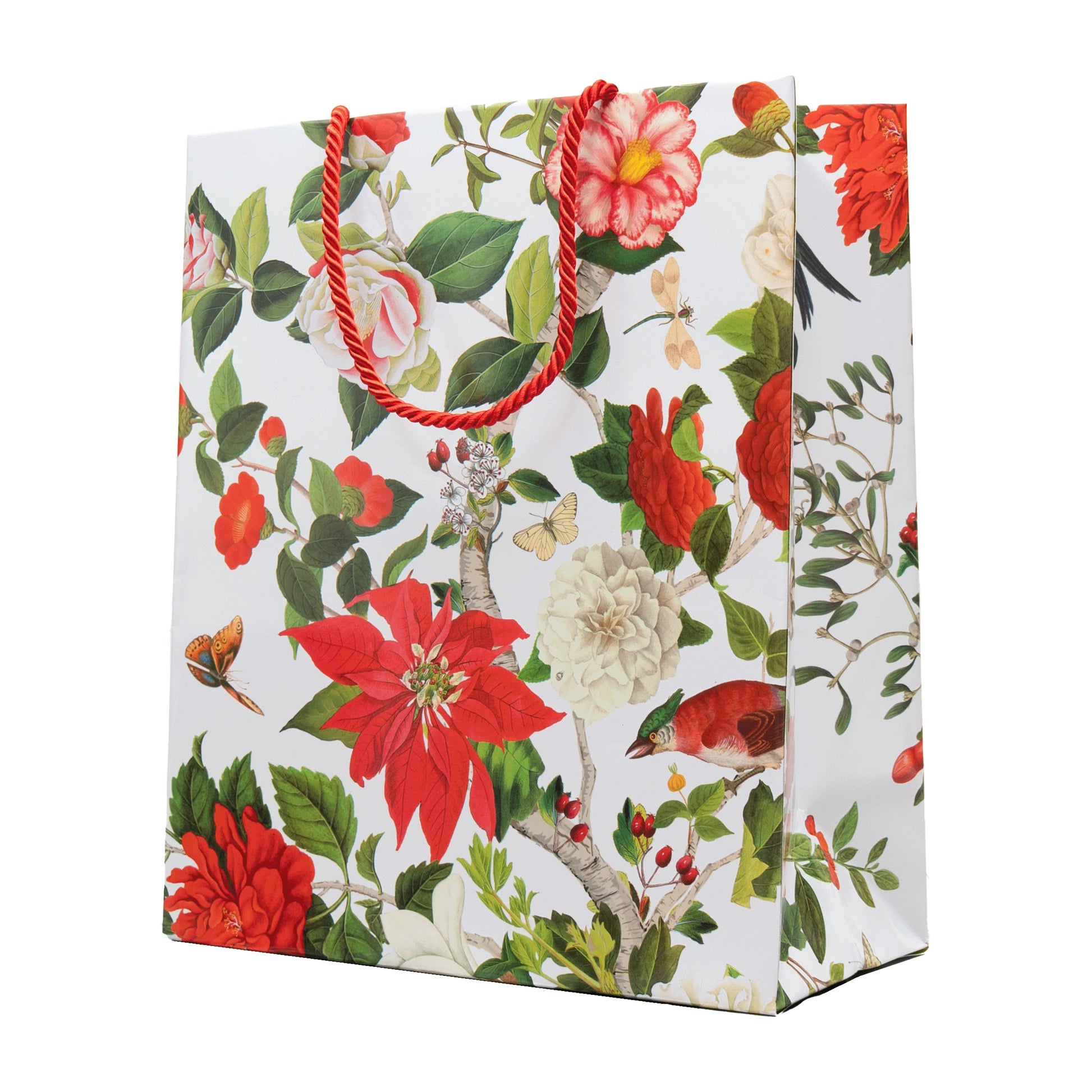 The Caspari Christmas Chinoiserie White Collection gift bag features red braided handles and colorful floral designs on white—perfect for pairing with party plates or disposable tableware at your next celebration.