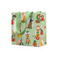 The Presenting Pets Collection gift bag by Caspari features green and white stripes with festive dog illustrations and green handles—ideal for pairing with disposable tableware or elegant paper plates at your next celebration.
