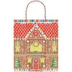 The Gingerbread House Collection gift bags by Caspari feature a festive gingerbread house, candy accents, two Christmas trees, and a red and white twisted handle—perfect for decorative holiday gifting.