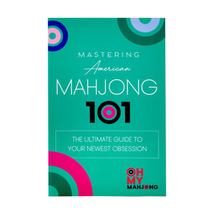 The cover of "Mahjong 101" by Oh My Mahjong has a teal background with circular patterns, making it ideal for beginners searching for a complete American Mahjong guide.